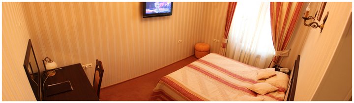 Standard room at the Cleopatra Hotel in Kamenets-Podilskyi. Book by promotion